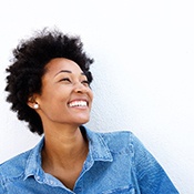 Woman with blue collared shirt smiling