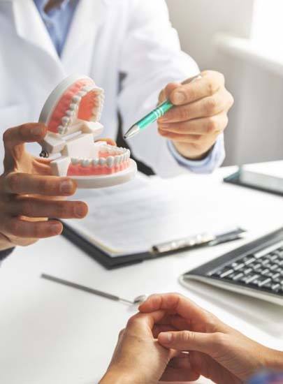 dentist discussing the cost of dental implants with a patient