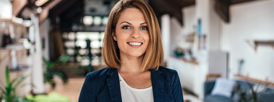 Woman sharing beautiful smile thanks to visiting her dental insurance dentist in Chula Vista