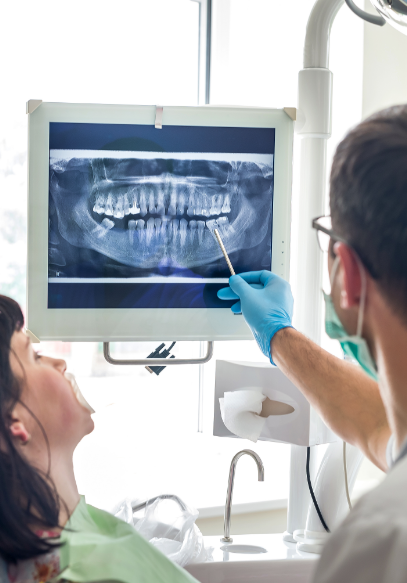 Overlapping images of a woman smiling at dentist and outside view of dental school building