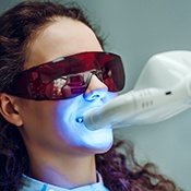 Woman benefiting from in-office teeth whitening