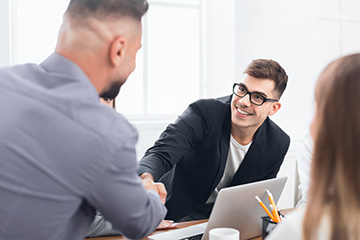 person smiling at job interview after teeth whitening
