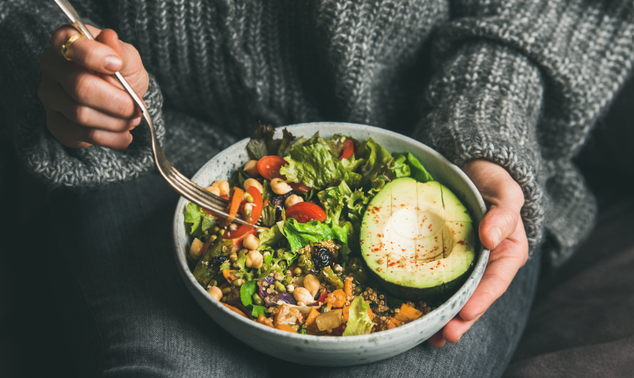 Woman eating salad bowl